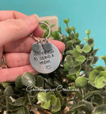 “Happiness is being a” keychain.