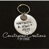 “Happiness is being a” keychain.